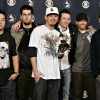 Linkin Park posing for a picture at an awards show